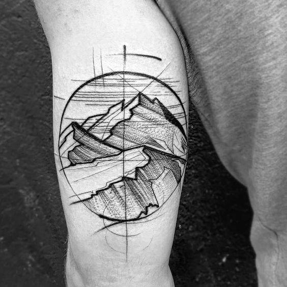 tatuaje geometrico montana para hombre 31