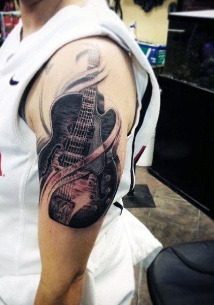 tatuaje guitarra 70